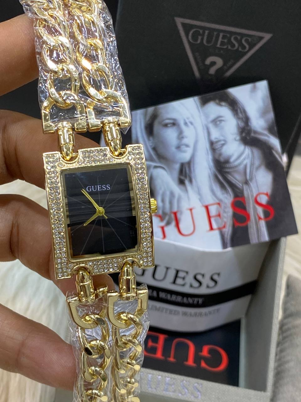 ساعةGUESS حريمي جولد *اسود